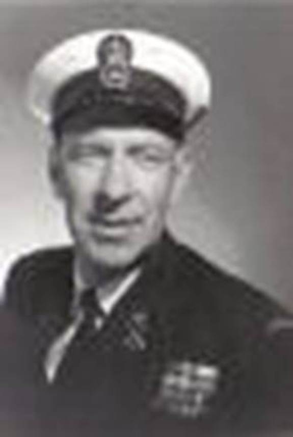 A person in a uniform and hat

Description automatically generated